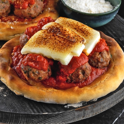 Meatballs with Red Sauce on Pizza Dough